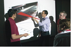 Professor Black and students with grainy video